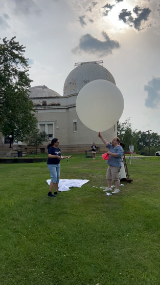 launching a balloon in front of the observatory